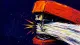 Forced Through A stapler jammed around an overstuffed stack, reflecting the pressure to keep taking on work that no