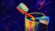 Two toothbrushes jammed into one cup, symbolizing pressure to merge lives too quickly because h​​ous