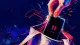 A hand catches a phone mid-drop into a tote, showing the urge to stop checking the group chat whilef