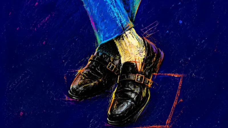 Crossed ankles and dress shoes caught mid-shuffle, showing the hesitation of trying to find a placei