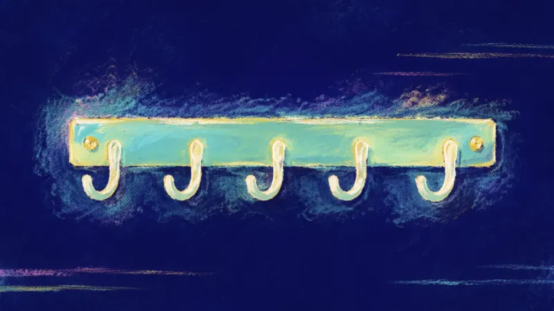 A restored hook rack with evenly open hooks, representing clear roommate agreements, mutual respect,