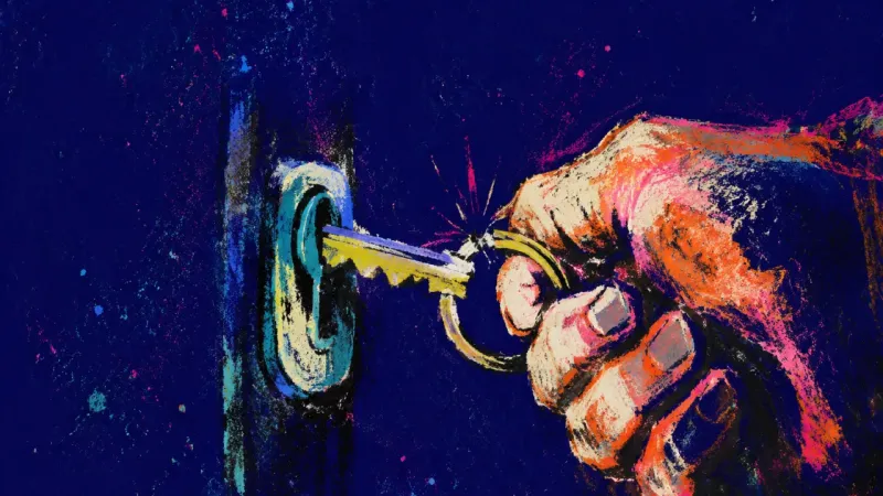 A clenched hand holds an apartment key mid-turn, reflecting the stalled choice between shared closen