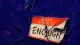 The Wrong Label A name tag repeatedly peeled and pressed down until the printed name splits and curls, symbolizing a