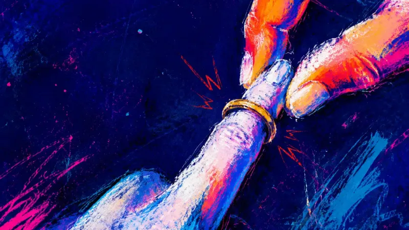 Two fingers holding a ring halfway off a knuckle, symbolizing the urge to remove the most recogniz­e