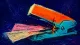 Clamped Permission A stapler jammed shut around two application forms, symbolizing pressure to choose a respectable ...