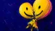 A smiling party balloon twisted into a tight knot, symbolizing how enforced positivity can silence