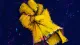 A dishwashing glove pulled into a compact knot, symbolizing self-erasure through compulsive helpful.