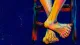 Two ankles lock around a chair rung as both feet curl, symbolizing hidden strain after suppressing 진