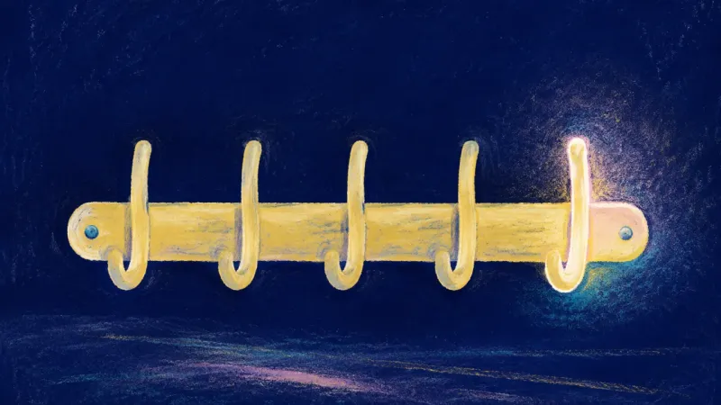 Hooks in Balance An orderly coat rack with distinct open hooks, symbolizing family belonging restored without the ely
