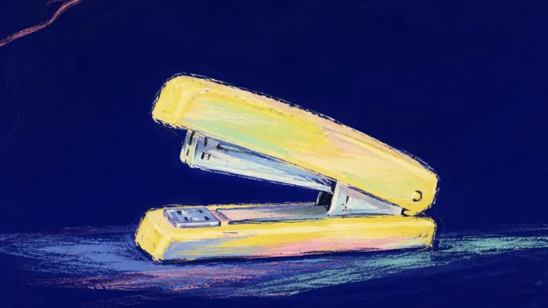 A restored, orderly stapler represents anger becoming clear information before a direct workplace re