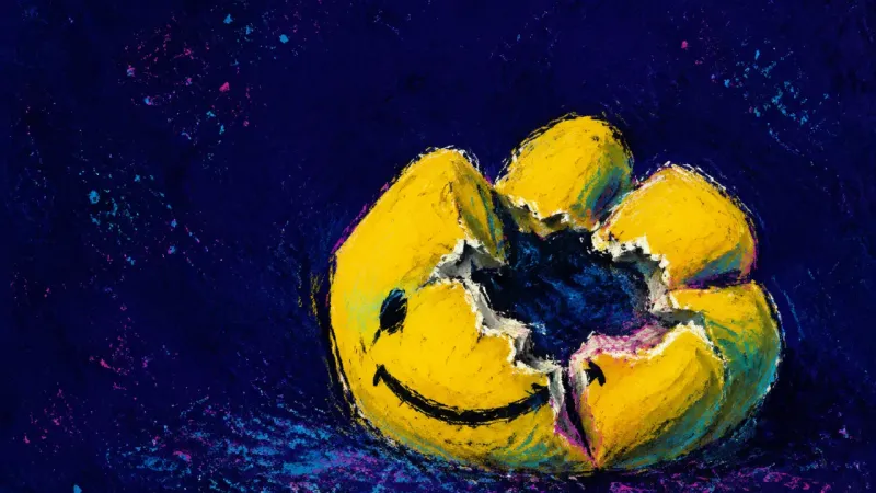 A crushed stress ball split around an empty center, symbolizing the private strain of succeeding in 