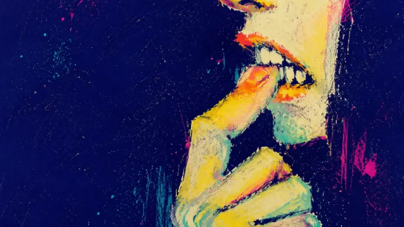 A cropped hand and mouth with teeth clamped on one fingertip, symbolizing the reflexive tension ​