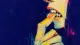A cropped hand and mouth with teeth clamped on one fingertip, symbolizing the reflexive tension ​