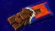 A snapped chocolate bar crushed inside its sealed wrapper, symbolizing pleasure deferred until the