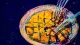 A dinner plate with one serving cut into countless tiny pieces, symbolizing self-editing and lost