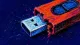 A USB flash drive jammed halfway open, symbolizing perfectionism that keeps a creative pitch from