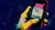 The Withheld Reach A hand pauses before replying to an invitation on a phone, symbolizing the isolation that can hide##