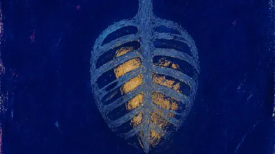 A solitary figure with a still ribcage, steel blue space pressing around pale amber light in a quiet dark room