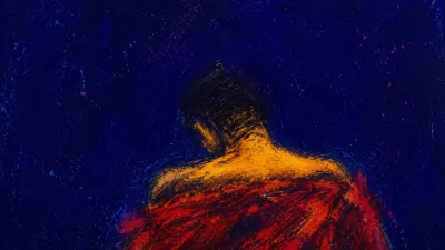 Solitary upright figure with squared shoulders, red-amber cloth over the torso, and cold indigo stone space around them