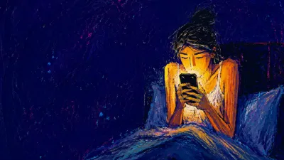 A seated figure clasps a phone at chest level, shoulders raised, amber screen glow fading into cold blue-grey in a bedroom.