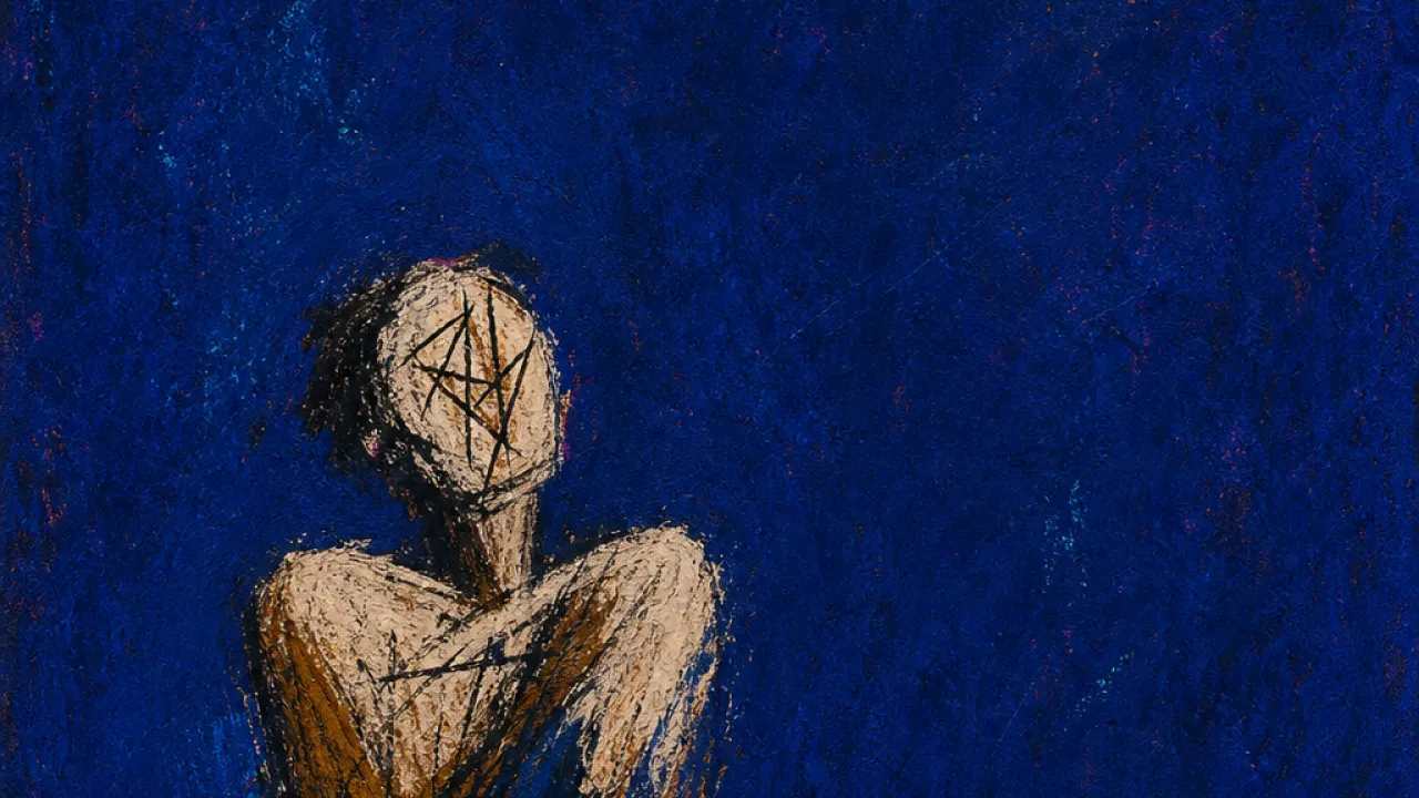 A room you can enter A solitary figure with raised shoulders in a quiet room, warm amber light held back by cold indigo space