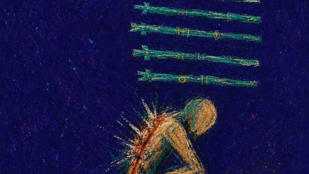 A figure bent under ordered green wands beside a laptop, spine compressed in amber against green-black shadow